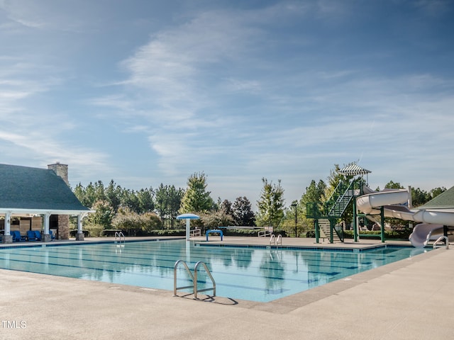 view of swimming pool featuring a water slide