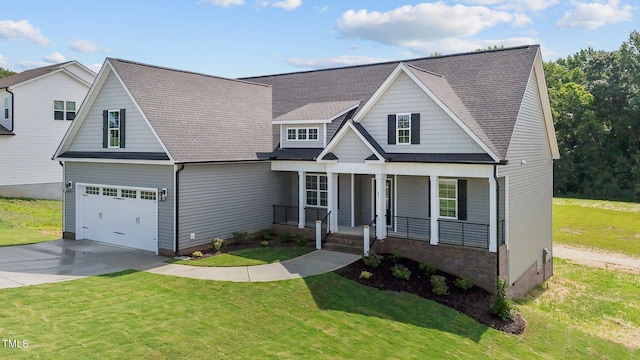 view of front of property featuring a garage and a front lawn