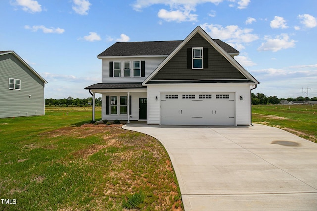 view of front of house featuring a front lawn and a garage