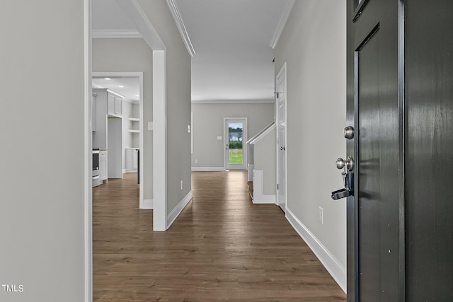 hallway with hardwood / wood-style flooring and ornamental molding