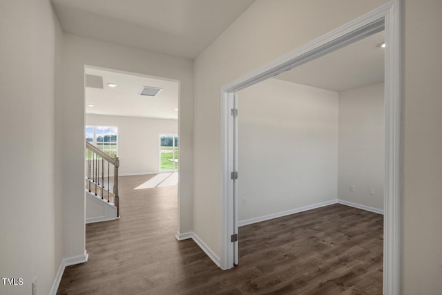 corridor with dark wood-type flooring