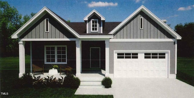 view of front of home featuring a porch and a garage