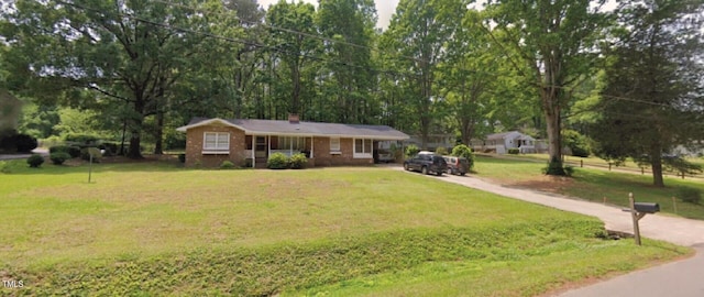 single story home featuring a front yard