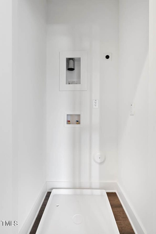 washroom with wood-type flooring, electric dryer hookup, and washer hookup