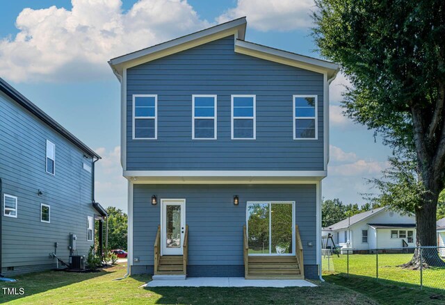 back of house featuring a yard