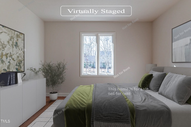 bedroom featuring light hardwood / wood-style flooring