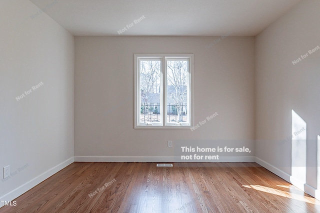 spare room featuring light wood-type flooring