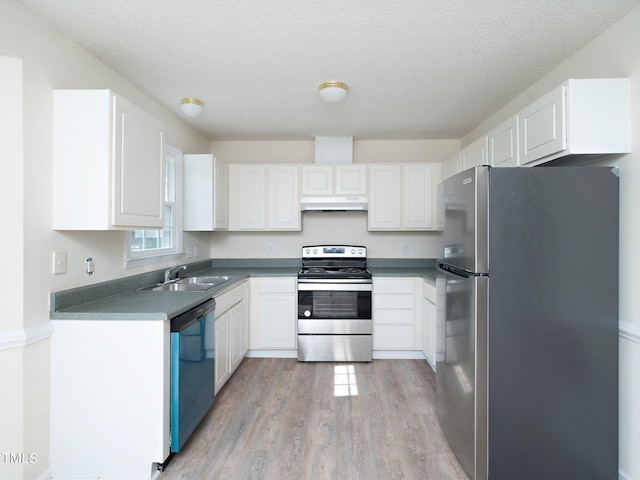 kitchen featuring light hardwood / wood-style floors, stainless steel appliances, a textured ceiling, white cabinets, and sink