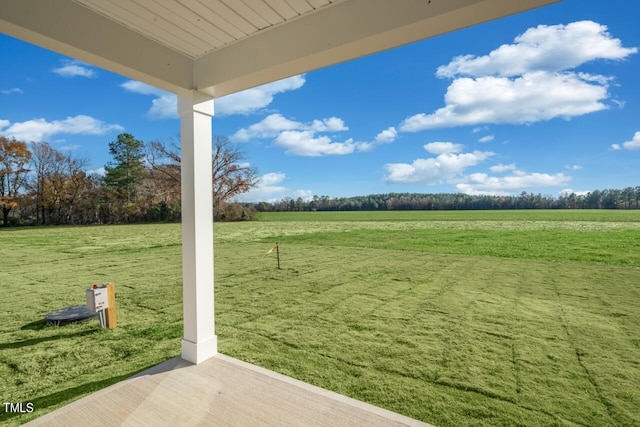 view of yard with a rural view