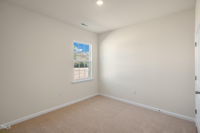 spare room featuring carpet flooring