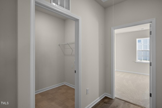 clothes washing area featuring hardwood / wood-style flooring