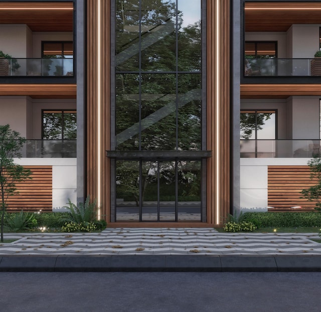 entrance to property with a balcony