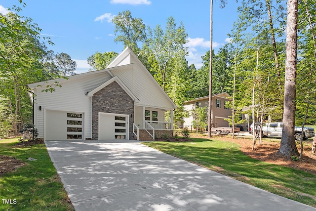 view of front of property featuring a garage and a front yard