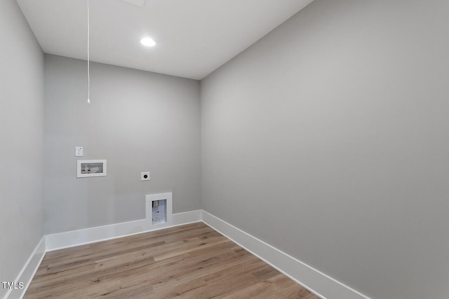 clothes washing area with washer hookup, hookup for an electric dryer, and light hardwood / wood-style flooring