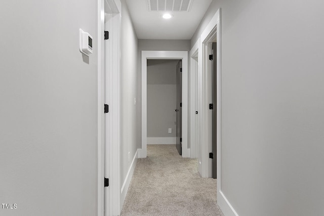 hallway with light carpet