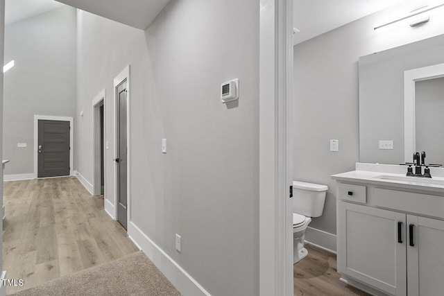 hall featuring sink and light hardwood / wood-style floors