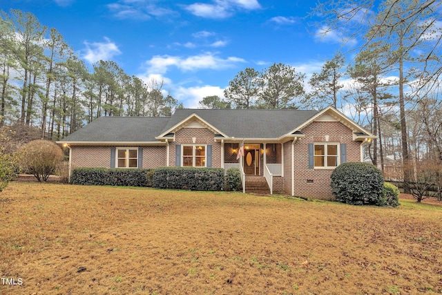 single story home featuring a front yard