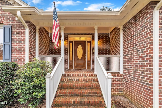 property entrance featuring covered porch