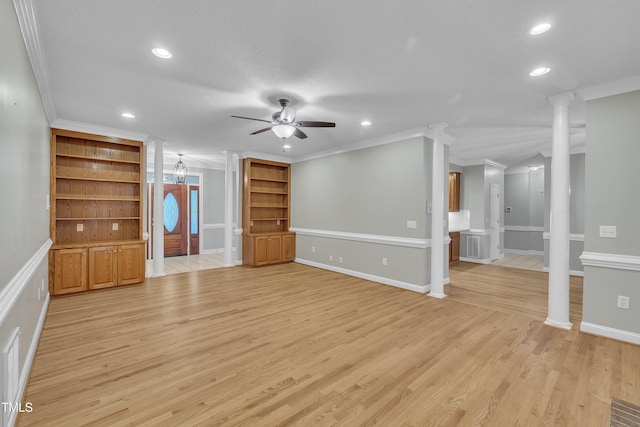 unfurnished living room with light hardwood / wood-style flooring, ceiling fan, built in features, ornate columns, and ornamental molding