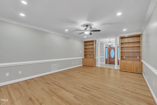 unfurnished living room featuring built in shelves, light hardwood / wood-style floors, ceiling fan, and ornamental molding