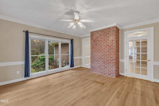 unfurnished room featuring a textured ceiling, ceiling fan, light hardwood / wood-style floors, and crown molding