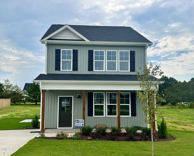 front facade featuring a front yard and a porch