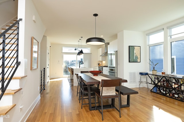 dining area featuring light wood-type flooring