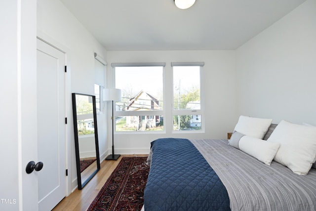 bedroom with light hardwood / wood-style floors