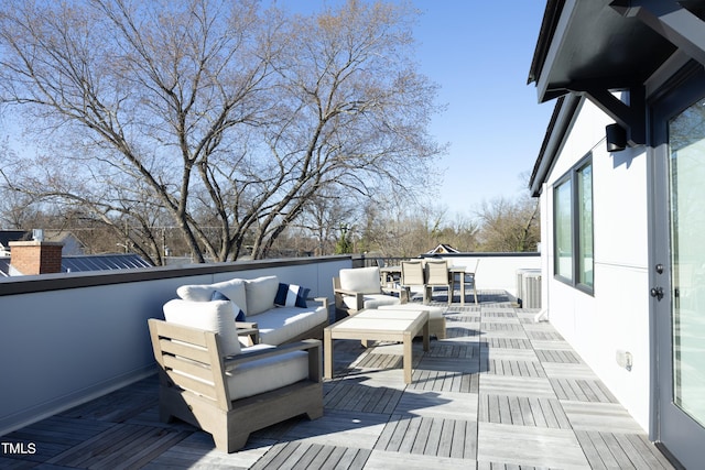 wooden terrace featuring an outdoor hangout area