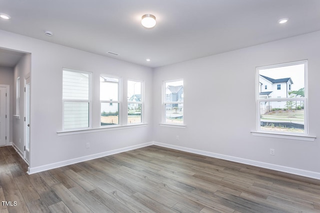 unfurnished room featuring dark wood-type flooring