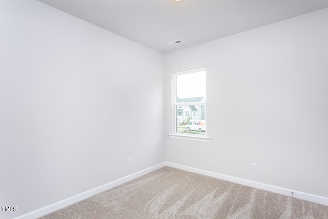 unfurnished room with carpet flooring