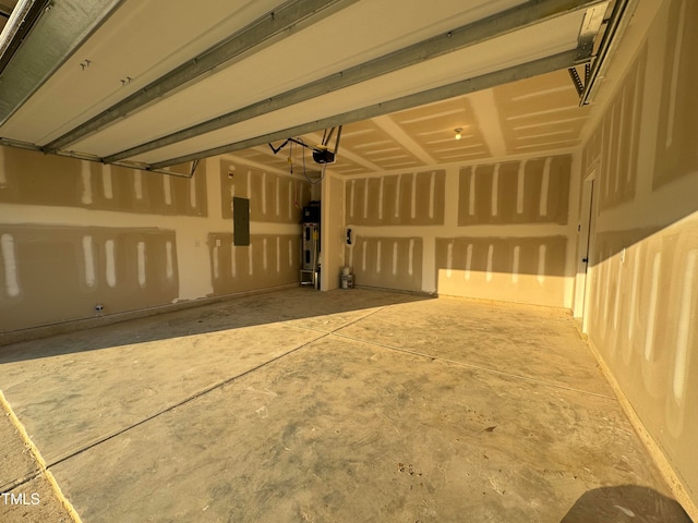 garage featuring electric panel, a garage door opener, and water heater