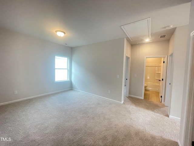 empty room with light colored carpet