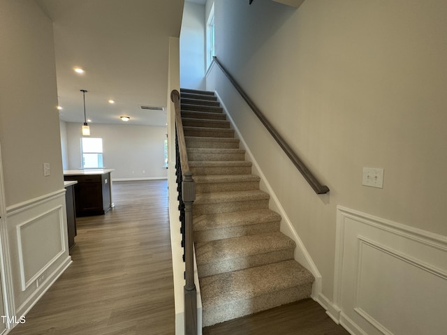 staircase featuring hardwood / wood-style flooring