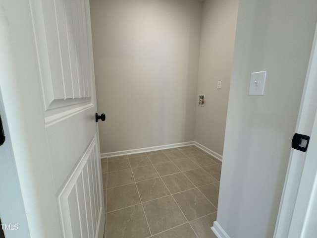 laundry area with light tile patterned flooring and hookup for a washing machine