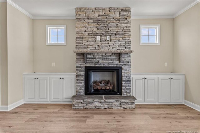 unfurnished living room with a fireplace, a healthy amount of sunlight, and light hardwood / wood-style flooring