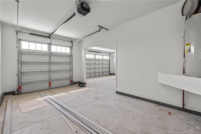 garage featuring electric water heater and a garage door opener