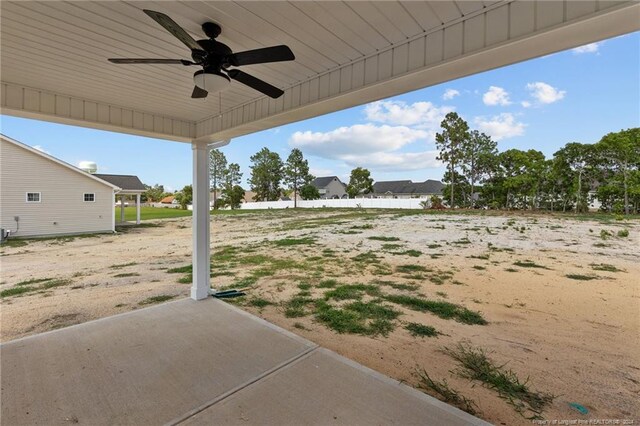 view of yard with ceiling fan