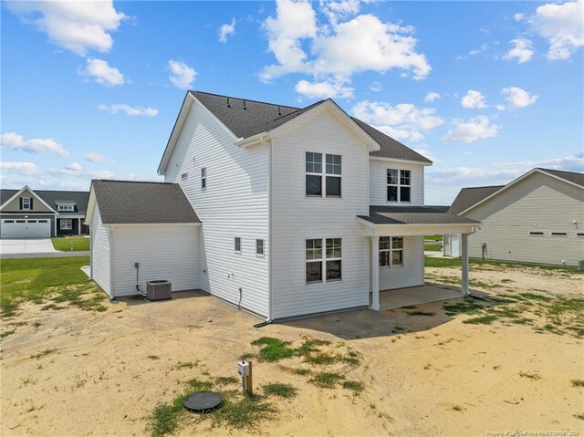 back of property with a patio and central AC unit