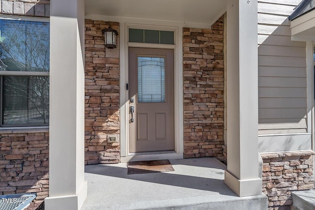 1001 Drayman Pl, Apex, NC 27502 - view of exterior entry with a porch and stone siding