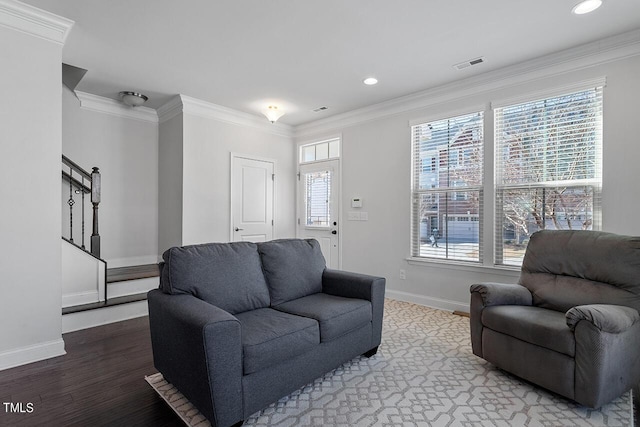 1001 Drayman Pl, Apex, NC 27502 - living area featuring baseboards, ornamental molding, stairs, wood finished floors, and recessed lighting
