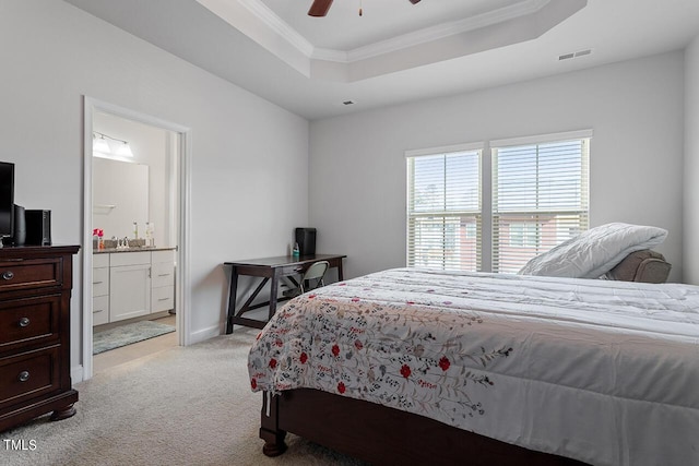 1001 Drayman Pl, Apex, NC 27502 - bedroom featuring a raised ceiling, light carpet, crown molding, ensuite bathroom, and ceiling fan