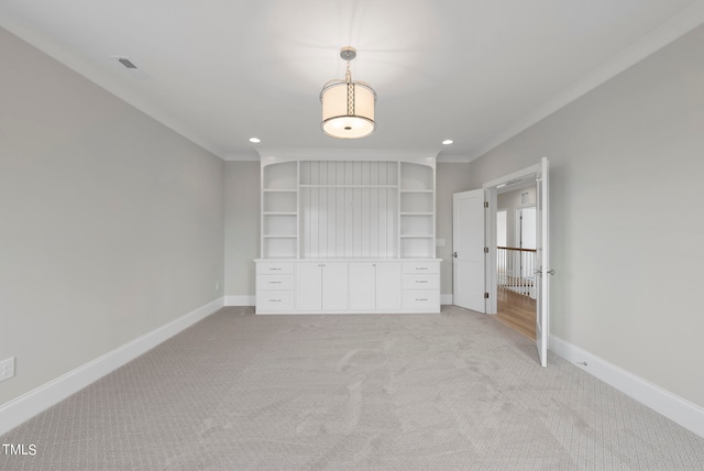 unfurnished bedroom with ornamental molding and light colored carpet