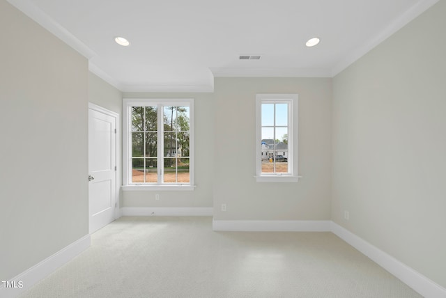 carpeted spare room with ornamental molding