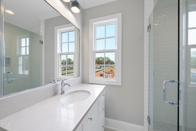 bathroom featuring oversized vanity and a shower with shower door