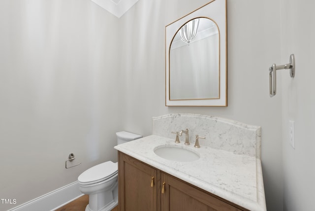 bathroom featuring toilet and vanity