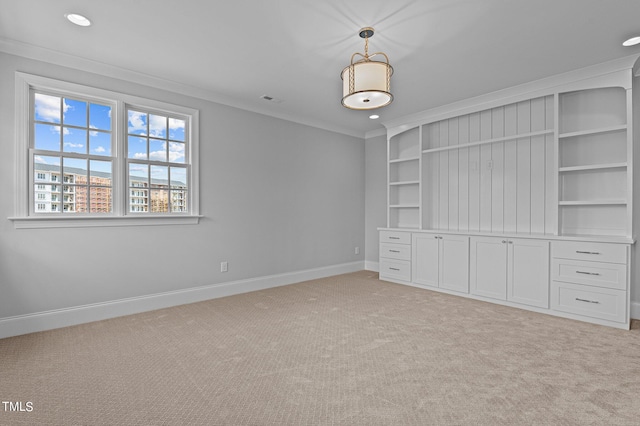 unfurnished bedroom with ornamental molding and light carpet