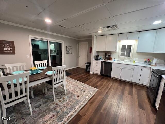 kitchen with white cabinetry, dishwasher, electric range, sink, and dark hardwood / wood-style flooring