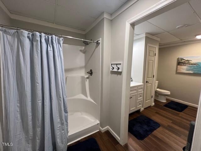 bathroom with toilet, hardwood / wood-style floors, vanity, and a shower with shower curtain