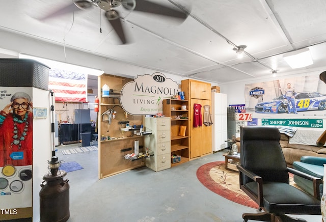 basement with a workshop area and ceiling fan